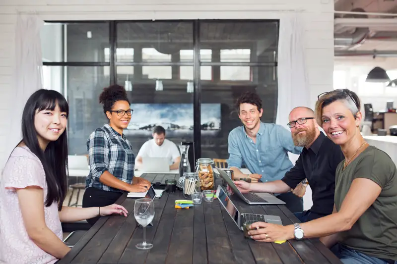 group-of-coworkers-looking-at-camera-one-man-work-2023-11-27-05-11-16-utc-800px